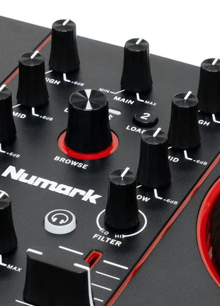 Close-up of a Numark DJ mixer with control knobs and Serato branding.