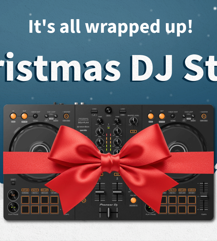 Black DJ equipment with red bows against a blue background with Christmas trees and snowflakes, promoting the 'Christmas DJ Store'.