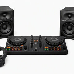 DJ controller bundle featuring a black 4-drum DJ controller in the center, flanked by two matching black studio speakers, with black over-ear headphones in the foreground on a clean white background.