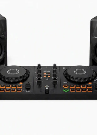 DJ controller bundle featuring a black 4-drum DJ controller in the center, flanked by two matching black studio speakers, with black over-ear headphones in the foreground on a clean white background.