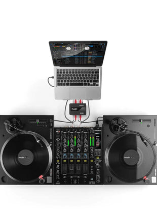 Reloop Flux Go DJ setup with laptop, reloop turntables, and mixer on a white background
